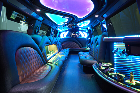 Limo service interior with colorful LED lights and wet bars